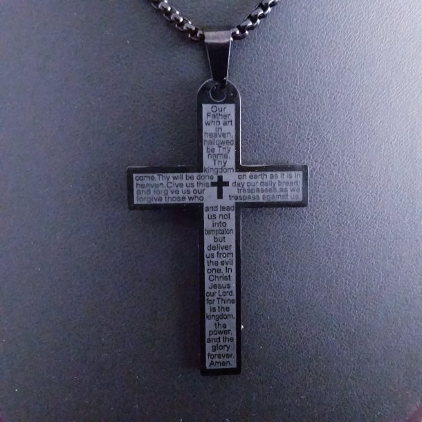 Sort stl kors med tekst p Gr baugrund 